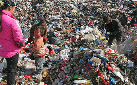 "Garbage Family"  Despite China's rapid economic growth and strict no-migration laws, there remains a marked disparity between the country's wealthy and the poor. This family, originally from Guizhou Province (far-western China) moved to the rich Delta Yangtze River coast in search of a better life. They currently work in a Jiangsu landfill, sifting through garbage in search of any re-sellable items.  In a country of 1.35 billion people (and still growing!) -- is there any room for Pandas or any other wildlife?  Photo and commentary by Sheilaz314/Flickr/cc