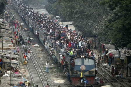 "OverLoaded Train" in India, more and more people are crammed into the same space, trying to live, breathe, grow food, find jobs and enjoy 'quality of life'.  In a country of 1.26 billion people (and still growing rapidly!) is there any room for tigers or elephants or other creatures?  Photo from churchandstate.org.uk